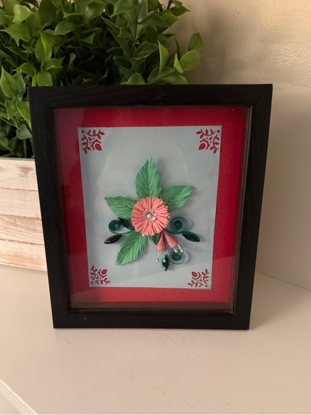 Handcrafted paper quilling art piece 3D floral design in a framed shadow box